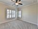 Comfortable bedroom with a ceiling fan, neutral walls, and large windows at 4360 Autry Way, Alpharetta, GA 30022