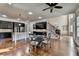 Spacious kitchen with dark cabinets and hardwood floors adjacent to staircase at 4360 Autry Way, Alpharetta, GA 30022