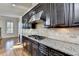 Kitchen with granite countertops, stainless steel appliances, and hardwood floors at 4360 Autry Way, Alpharetta, GA 30022