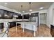 Open kitchen with granite countertops, stainless steel appliances, and hardwood floors at 4360 Autry Way, Alpharetta, GA 30022