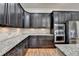 Kitchen with granite countertops, stainless steel appliances, and dark wood cabinets at 4360 Autry Way, Alpharetta, GA 30022