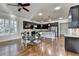 Kitchen with granite countertops, stainless steel appliances, and dining area at 4360 Autry Way, Alpharetta, GA 30022