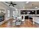 Open kitchen and dining area features dark cabinets and stainless steel appliances at 4360 Autry Way, Alpharetta, GA 30022