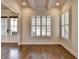 Elegant living space with hardwood floors, white trim, and plantation shutters at 4360 Autry Way, Alpharetta, GA 30022