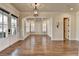 Bright living space featuring hardwood floors, white trim, and glass panel doors at 4360 Autry Way, Alpharetta, GA 30022