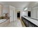 Elegant bathroom with a soaking tub, dual vanities, and access to the walk-in closet at 4360 Autry Way, Alpharetta, GA 30022