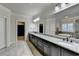 Large bathroom featuring a large mirror, granite counter top, soaking tub, and a walk-in closet at 4360 Autry Way, Alpharetta, GA 30022