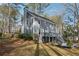 View of home's backyard with a deck, patio, and lush greenery for outdoor enjoyment at 710 Melanie Ct, Canton, GA 30115