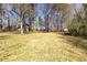 The expansive backyard is ideal for outdoor activities and relaxation, with mature trees and landscaping at 710 Melanie Ct, Canton, GA 30115