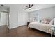 Comfortable bedroom with a ceiling fan, hardwood floors, natural light, and neutral colors at 710 Melanie Ct, Canton, GA 30115