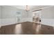 Bright dining room with hardwood floors, chandelier, and a view into the breakfast nook at 710 Melanie Ct, Canton, GA 30115