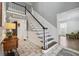 Elegant foyer features a staircase, beautiful flooring, and natural lighting at 710 Melanie Ct, Canton, GA 30115