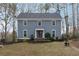 Inviting home featuring a well-manicured lawn and garden beds enhancing the property's curb appeal at 710 Melanie Ct, Canton, GA 30115