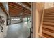 Unfinished basement/garage space, with access to the upper floor via wooden stairs at 710 Melanie Ct, Canton, GA 30115