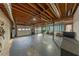 Unfinished garage with exposed ceiling and multiple garage door access points at 710 Melanie Ct, Canton, GA 30115