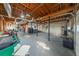 Spacious unfinished garage with exposed ceiling and multiple garage door access points at 710 Melanie Ct, Canton, GA 30115