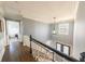 Hallway with hardwood floors, white banister, and open layout at 710 Melanie Ct, Canton, GA 30115