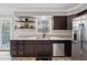 Updated kitchen featuring stainless steel appliances, granite countertops, and backyard views at 710 Melanie Ct, Canton, GA 30115