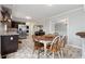 Kitchen and breakfast nook with stainless steel appliances, updated backsplash, and casual seating at 710 Melanie Ct, Canton, GA 30115