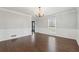 Living room featuring hardwood floors, wainscoting, and a view of the front yard at 710 Melanie Ct, Canton, GA 30115