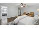 Bright main bedroom with hardwood floors and view into the bathroom at 710 Melanie Ct, Canton, GA 30115