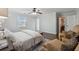 Bright main bedroom with a ceiling fan, ensuite, sitting area and a neutral color scheme at 710 Melanie Ct, Canton, GA 30115