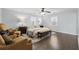 Spacious main bedroom with hardwood floors, ceiling fan, and large windows at 710 Melanie Ct, Canton, GA 30115