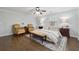 Charming main bedroom with hardwood floors, ceiling fan, and accent rug at 710 Melanie Ct, Canton, GA 30115