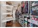Walk-in closet features wire racks and shelving for optimal organization and storage of items at 710 Melanie Ct, Canton, GA 30115
