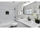 Updated bathroom features black fixtures and a black tiled niche at 3825 Lavista Rd # Q3, Tucker, GA 30084