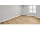 Bedroom features a window with bright natural light and wood-look flooring at 3825 Lavista Rd # Q3, Tucker, GA 30084
