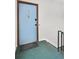 Apartment entryway featuring a light blue door and hallway stairs at 3825 Lavista Rd # Q3, Tucker, GA 30084