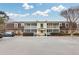 Exterior full view of multi-unit townhouse with screened porch at 3825 Lavista Rd # Q3, Tucker, GA 30084