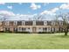 Expansive two-story home with a long front porch, manicured lawn, and mature trees at 3825 Lavista Rd # Q3, Tucker, GA 30084