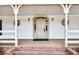 Charming entryway with brick steps, elegant columns, and a classic front door with sidelights at 3825 Lavista Rd # Q3, Tucker, GA 30084