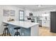 Eat-in kitchen boasts an island with barstool seating, white cabinets, stainless appliances, and light countertops at 3825 Lavista Rd # Q3, Tucker, GA 30084