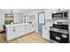 Kitchen featuring stainless steel appliances, white countertops, shaker cabinets, and blue paneled doors at 3825 Lavista Rd # Q3, Tucker, GA 30084
