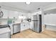 Bright kitchen featuring stainless steel appliances, sleek countertops and stylish cabinets at 3825 Lavista Rd # Q3, Tucker, GA 30084