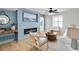 Stylish living room featuring a modern fireplace, wood-look floors, and bright, modern furniture at 3825 Lavista Rd # Q3, Tucker, GA 30084