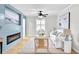 Modern living room with fireplace, wood-look floors, and stylish, bright furniture at 3825 Lavista Rd # Q3, Tucker, GA 30084