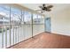 Enclosed sunroom with wood-painted floors, ceiling fan and neighborhood view at 3825 Lavista Rd # Q3, Tucker, GA 30084