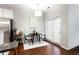 Bright dining area adjacent to the kitchen, with a small table and access to a patio at 4766 Longcourt Se Dr, Atlanta, GA 30339