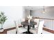 Bright dining space with a round table, neutral chairs, and stylish interior design at 4766 Longcourt Se Dr, Atlanta, GA 30339