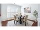 Cozy dining room featuring a round table with four chairs, elegant decor, and natural light at 4766 Longcourt Se Dr, Atlanta, GA 30339
