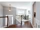 Bright dining room with hardwood floors, modern light fixture, and a decorative rug at 4766 Longcourt Se Dr, Atlanta, GA 30339