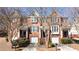 Beautiful red brick townhome with attached garages and professionally landscaped front yards at 4766 Longcourt Se Dr, Atlanta, GA 30339