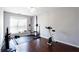 Bright room featuring home gym, dark floors and large window at 4766 Longcourt Se Dr, Atlanta, GA 30339