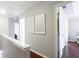 Upstairs hallway with railing at 4766 Longcourt Se Dr, Atlanta, GA 30339