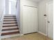 Hallway featuring closet and stairs with dark wood steps at 4766 Longcourt Se Dr, Atlanta, GA 30339