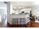 Modern kitchen with stainless steel appliances, white cabinets, and bar stool seating at 4766 Longcourt Se Dr, Atlanta, GA 30339